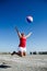 A woman jumps with a beach ball at the Salton Sea, California`s biggest lake in the ghost town of Bombay Beach