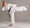 Woman karate activly working legs.