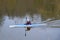 A woman on a kayak floating on the river