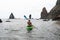 Woman kayak sea. Happy tourist enjoy taking picture outdoors for memories. Woman traveler posing in kayak canoe at sea