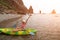 Woman kayak sea. Happy tourist enjoy taking picture outdoors for memories. Woman traveler posing in kayak canoe at sea