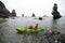 Woman kayak sea. Happy tourist enjoy taking picture outdoors for memories. Woman traveler posing in kayak canoe at sea