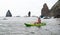 Woman kayak sea. Happy tourist enjoy taking picture outdoors for memories. Woman traveler posing in kayak canoe at sea