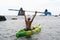 Woman kayak sea. Happy woman kayaks in sea, capturing outdoor memory with happy tourist taking photo. Volcanic mountains