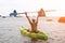 Woman kayak sea. Happy woman kayaks in sea, capturing outdoor memory with happy tourist taking photo. Volcanic mountains