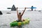 Woman kayak sea. Happy woman kayaks in sea, capturing outdoor memory with happy tourist taking photo. Volcanic mountains