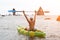 Woman kayak sea. Happy woman kayaks in sea, capturing outdoor memory with happy tourist taking photo. Volcanic mountains