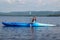 Woman kayaking on a calm lake