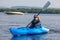 Woman kayaking on a calm lake