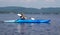 Woman kayaking on a calm lake