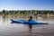 Woman kayaking on a calm lake