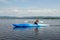 Woman kayaking on a calm lake