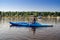Woman kayaking on a calm lake