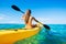 Woman Kayaking in the Ocean on Vacation