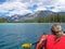 Woman kayaking with red inflatable kayak on Edith Lake, Jasper, Rocky Mountains, Canada