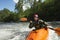 Woman kayaking in river