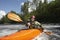 Woman kayaking in river