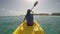 Woman Kayaking On Sea Against Sky