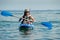 Woman kayaking in a tropical sea