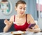 Woman keeping diet, eating rice and texting message