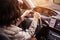 Woman keeping the wheel of a car