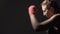 Woman kickboxer training in the gym, shadow fighting, Muay Thai martial art