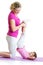 Woman and kid daughter do gymnastic exercise