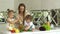 Woman With Kids Cooking Vegetables Salad At Kitchen