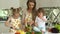 Woman With Kids Cooking Vegetables Salad At Kitchen