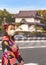 Woman in kimono in front of a dungeon of the Tokyo Imperial palace.