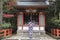 Woman in kimono pulling the bell-rope as a sign of devotion at the Yasaka jinja shrine in Kyoto