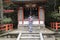 Woman in kimono pulling the bell-rope as a sign of devotion at the Yasaka jinja shrine in Kyoto