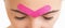 Woman with kinesio tape over eyebrows.