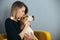 Woman kiss puppy of beagle