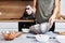 Woman in kitchen cooking a cake. Hands beat the dough with an electric mixer