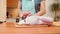 A woman in the kitchen cuts duck meat on a cutting board. Preparing a festive dinner.