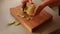 woman in the kitchen peels apples for apple cake