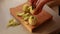 woman in the kitchen peels apples for apple cake