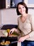 Woman is on the kitchen prepares to eat