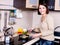 Woman is on the kitchen prepares to eat