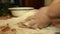 Woman knead the dough on the table