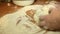 Woman knead the dough on the table