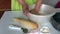 The woman is kneading the dough. Butter, sugar and flour in a bowl. Levington cake, stages of preparation