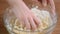 Woman kneading dough, close-up.