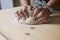 Woman kneading pizza dough