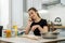 A woman kneads the dough with different ingredient. Healthy family food