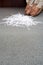 Woman kneeling by shredded paper