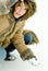 Woman kneeling in snow