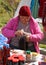 Woman with knitting for to make souvenir piece