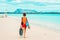 Woman at La Cinta beach and Blue waters of Mediterranean Sea in San Teodoro in Sardinia Island in Italy. Tavolara Island seen on